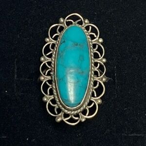 sterling silver oval filigree ring. Blue stone. Feminine. Bold. Unique.